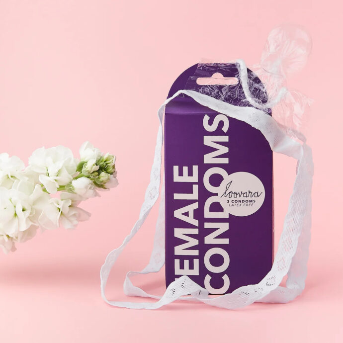 Purple box of Loovara brand Female Condoms, with one condom placed over the box.
